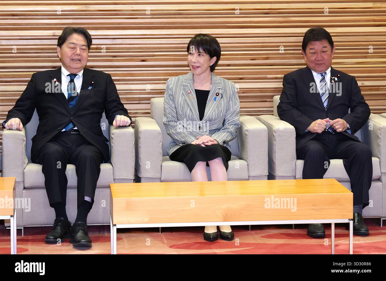 Japanese Prime Minister Sanae Takaichi (C) attends a cabinet meeting at ...
