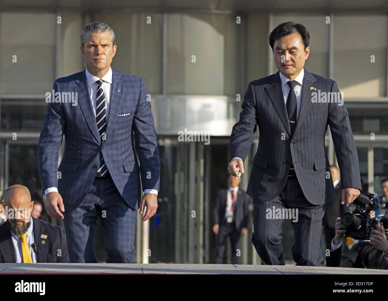U.S. Defense Secretary Pete Hegseth (L) attends a welcome ceremony ...