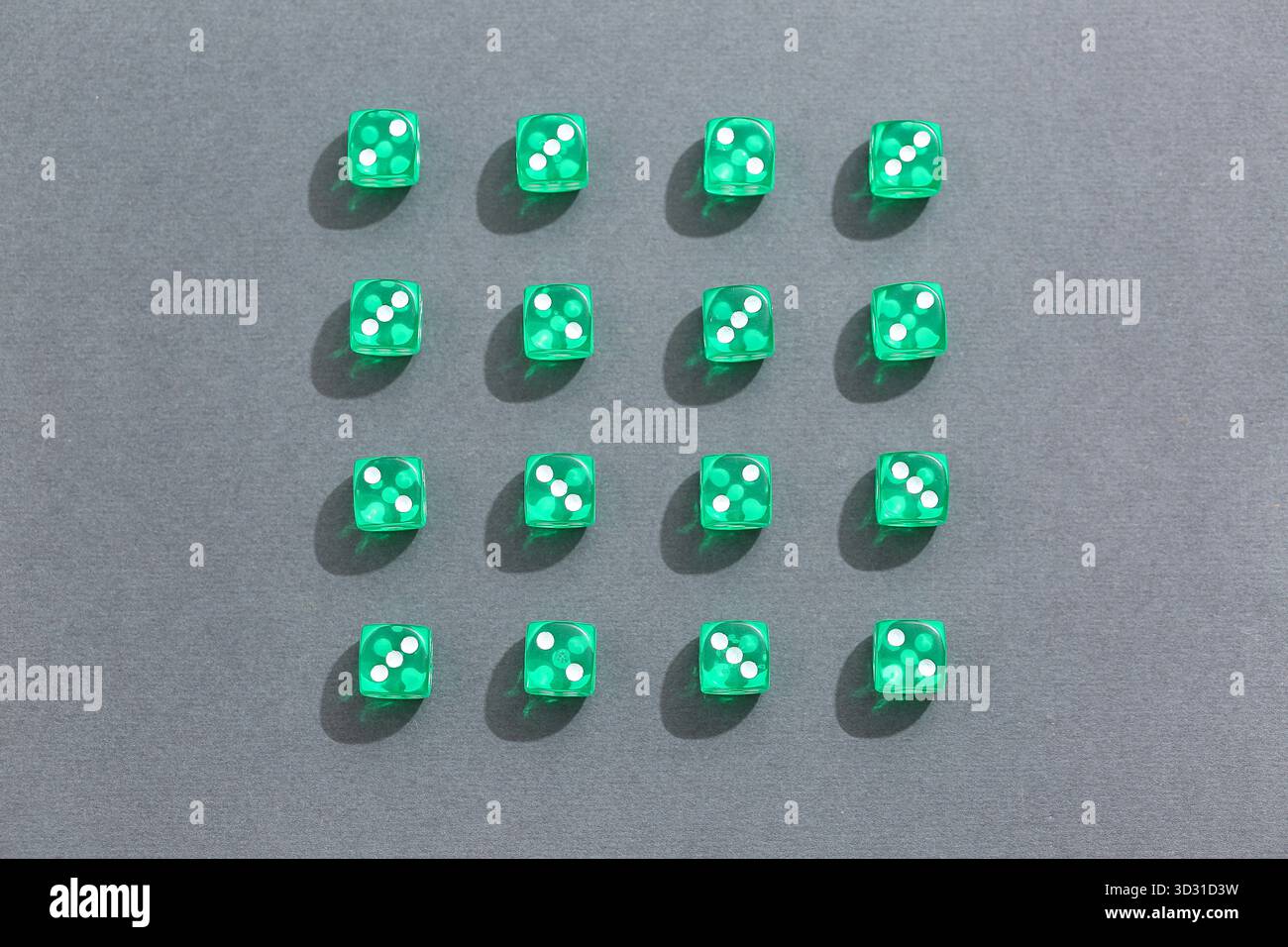 Green game dices on grey background Stock Photo
