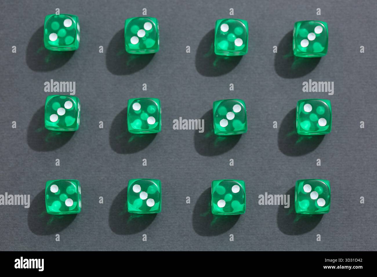 Green game dices on grey background Stock Photo