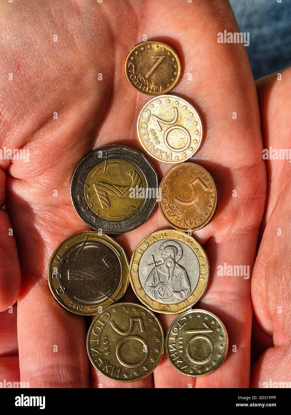 Bulgarian Lev Coins on hand. BGN Currency Held in Palm. Financial Concept with Bulgarian Lev - Smartphone Captured Stock Image
