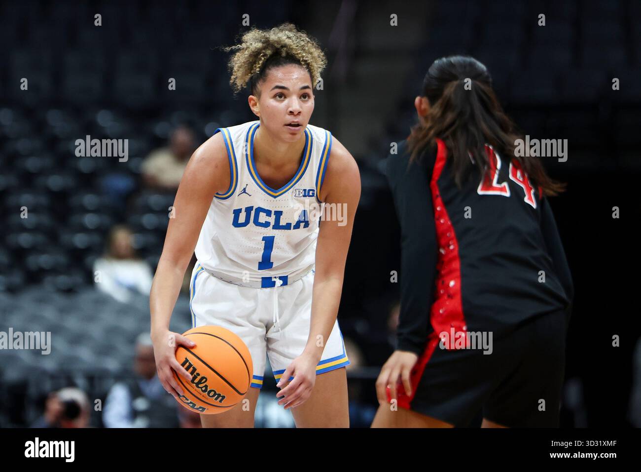UCLA guard Kiki Rice (1) looks on with the ball against San Diego State ...