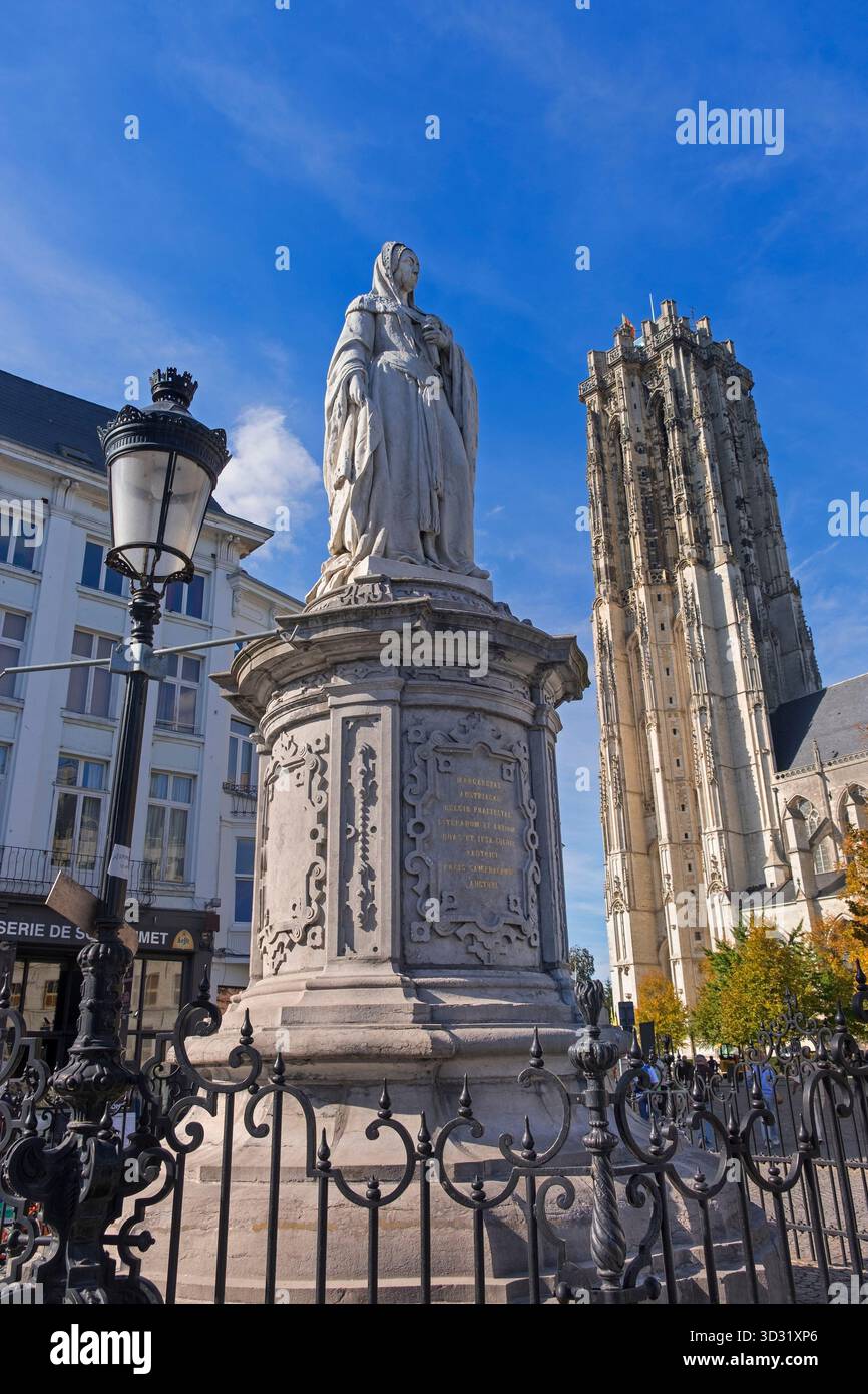 Margaret of Austria statue and St. Rumbold's Cathedral tower Mechelen Belgium Stock Photo