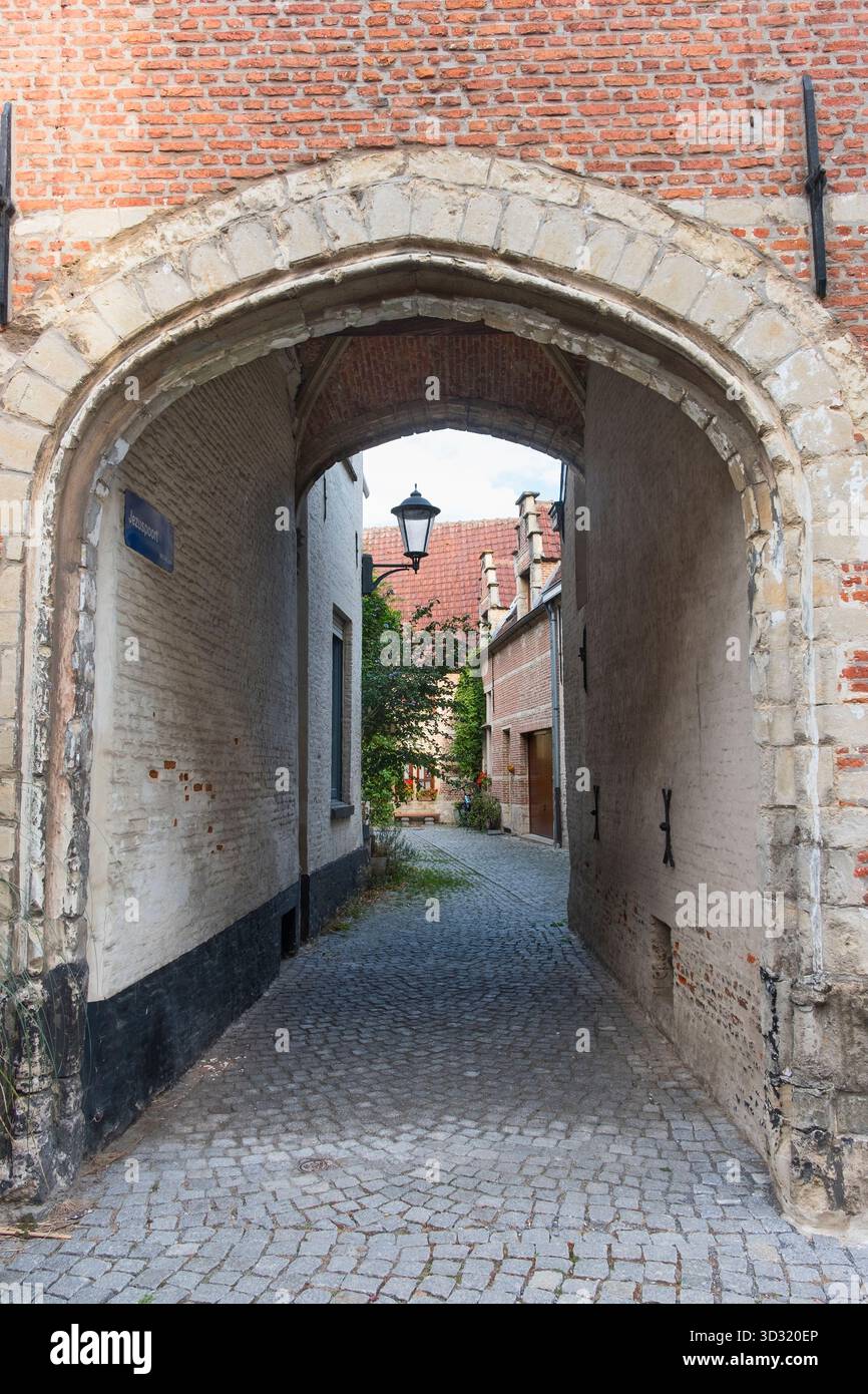 Jezuspoort Old cobbled alley Mechelen Belgium Stock Photo