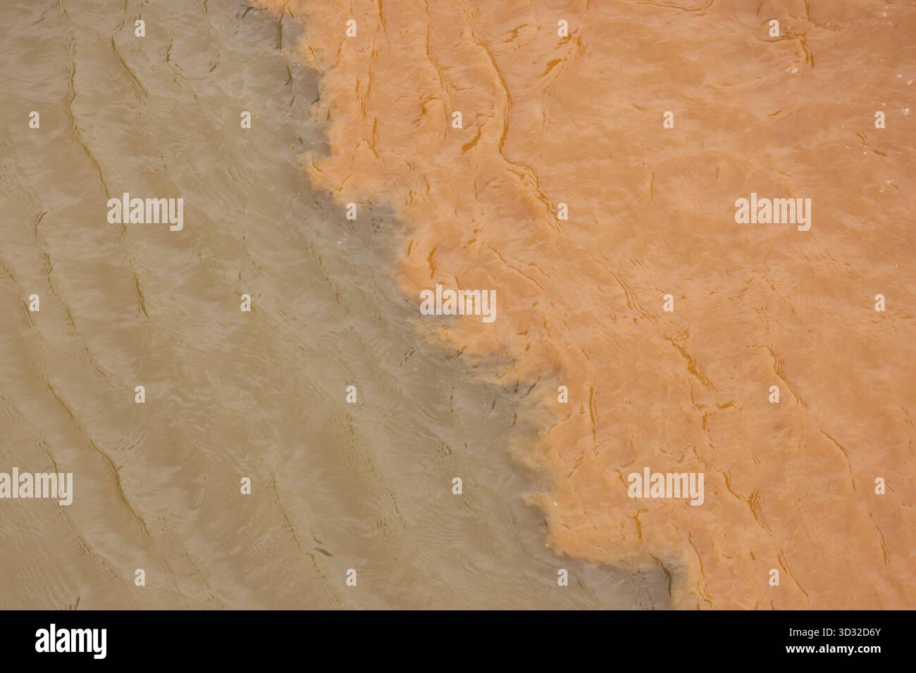 Merging Rivers Dramatic aerial view of river confluence, where two bodies of water ...