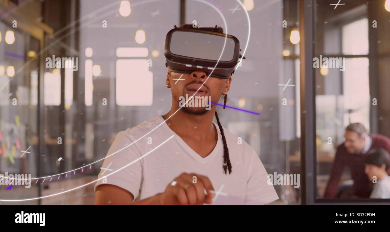 Navigating augmented reality developer wearing VR headset in coworking space with sticky notes Stock Photo