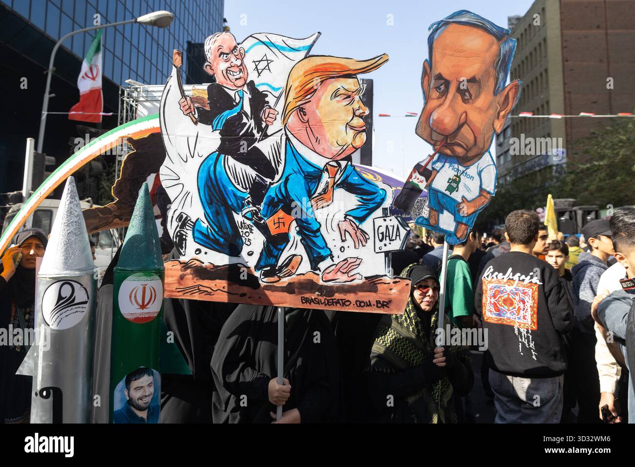 Tehran, Iran. 04th Nov, 2025. Protesters carry effigies of U.S. President Donald Trump and Israeli Prime Minister Benjamin Netanyahu during a rally marking the 46th anniversary of the U.S. Embassy takeover. Credit: SOPA Images Limited/Alamy Live News Stock Photo