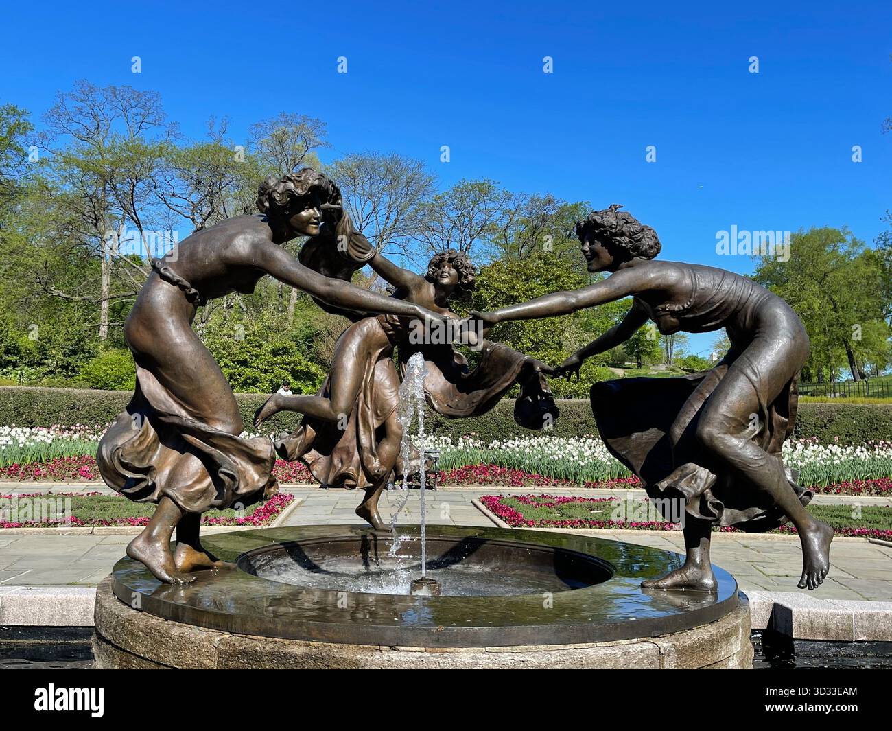 The Three Dancing Maidens statue graces Central Park’s Conservatory Garden with timeless elegance - Smartphone Captured Stock Image