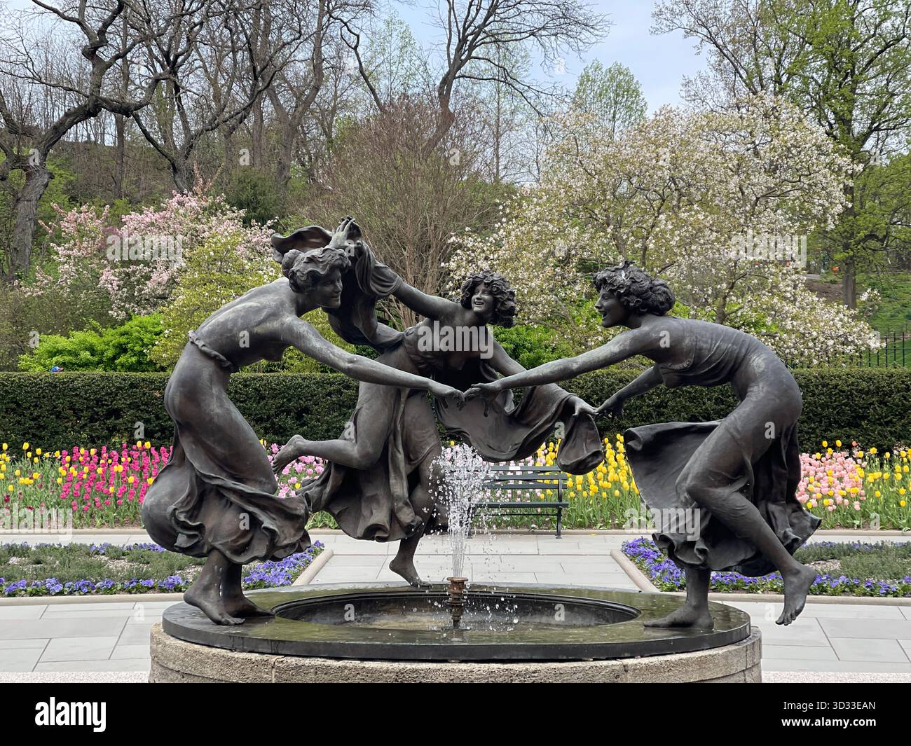 The Three Dancing Maidens statue graces Central Park’s Conservatory Garden with timeless elegance - Smartphone Captured Stock Image