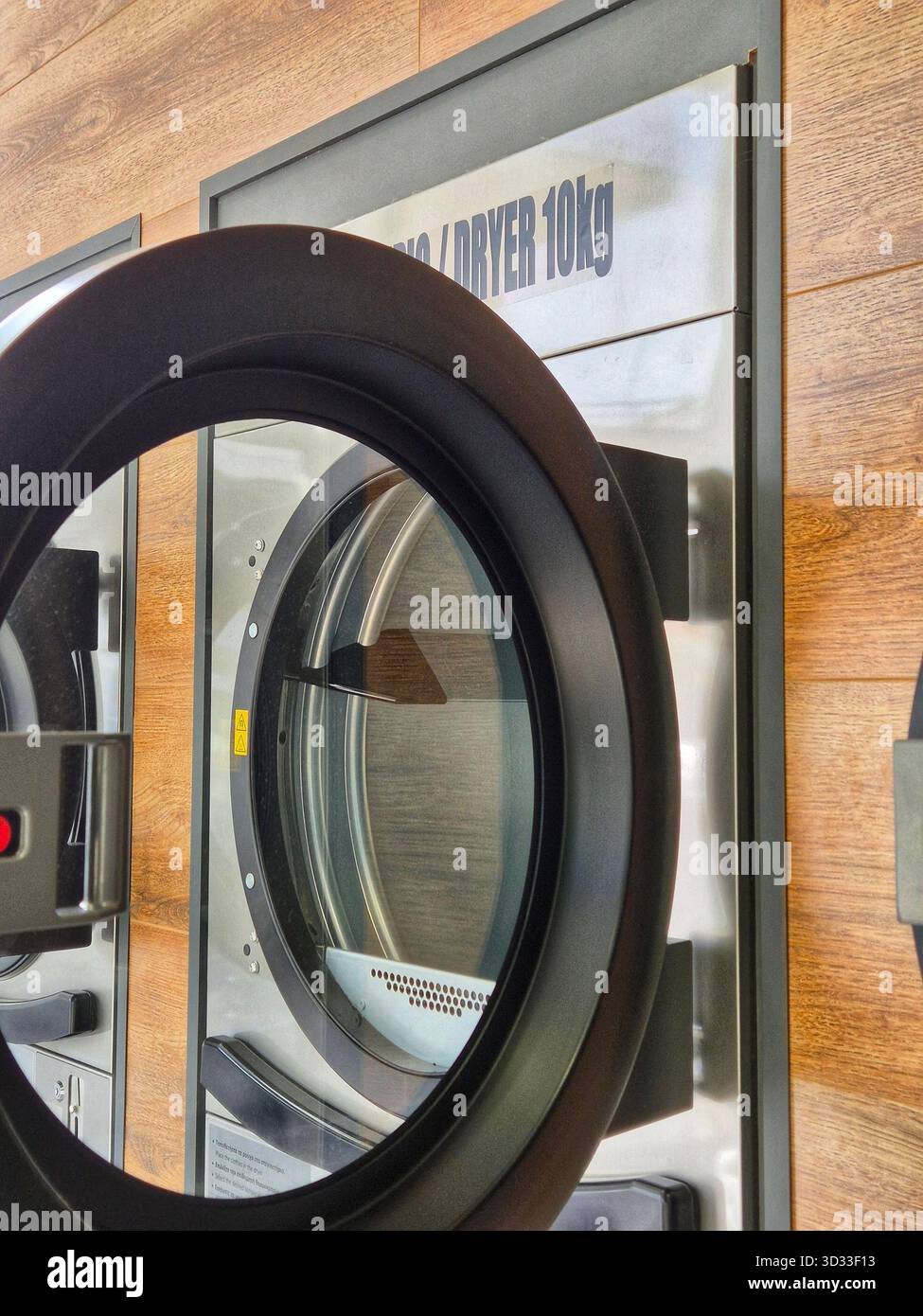 Industrial Laundry Machine Drum Coin-Operated Commercial Washer - Smartphone Captured Stock Image