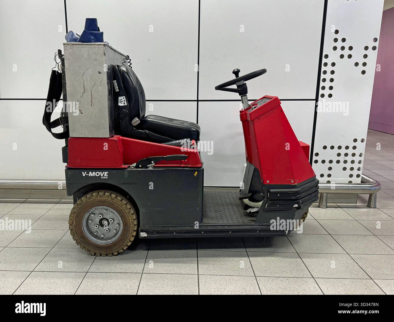 Amsterdam, Schiphol, the Netherlands - October 18, 2025: Red V-Move 1500 electric airport tow tractor. Stock Photo
