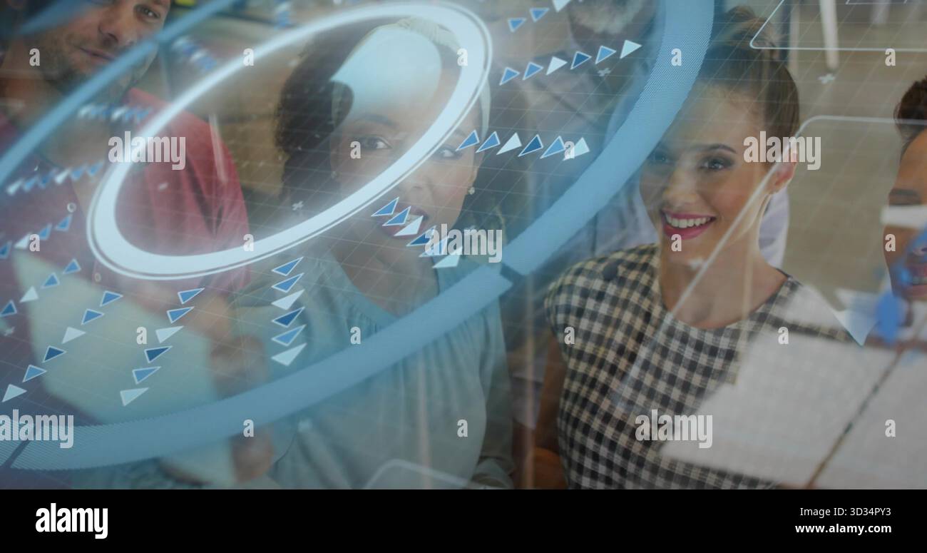Collaborating five professionals using glass touchscreen panel in office with data visualizations Stock Photo