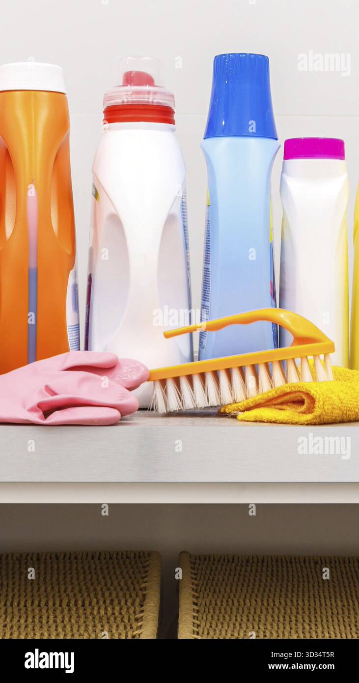 Cleaning items on the table in modern laundry room Stock Photo