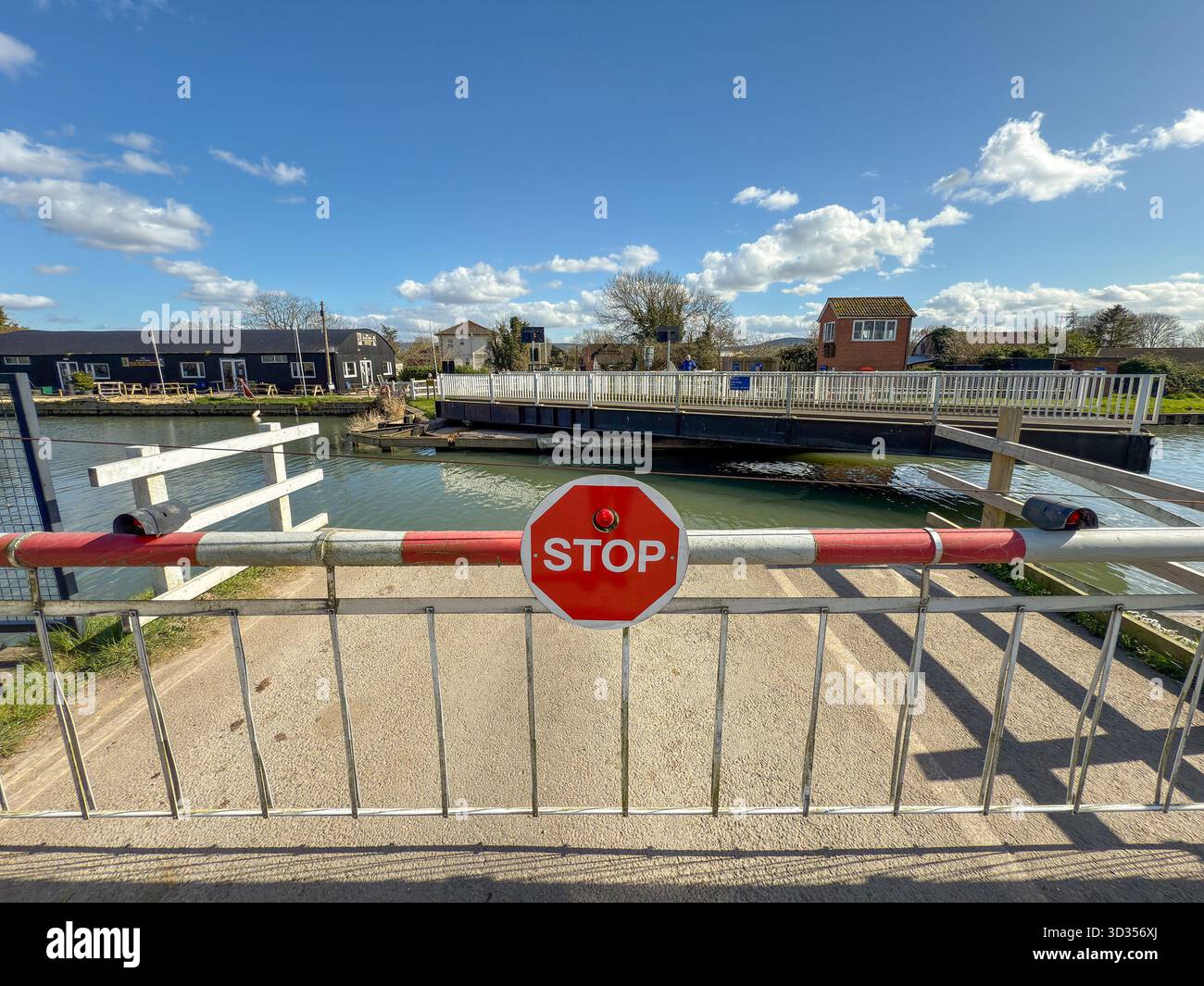 Gloucester, Gloucestershire, England, UK - 28 March 2025: Stop sign on the barrier of a swing bridge on the Gloucester and Sharpness Canal - Smartphone Captured Stock Image