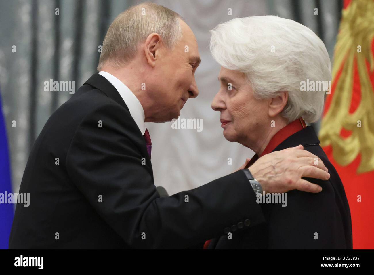 russian-president-vladimir-putin-left-embraces-the-head-of-the