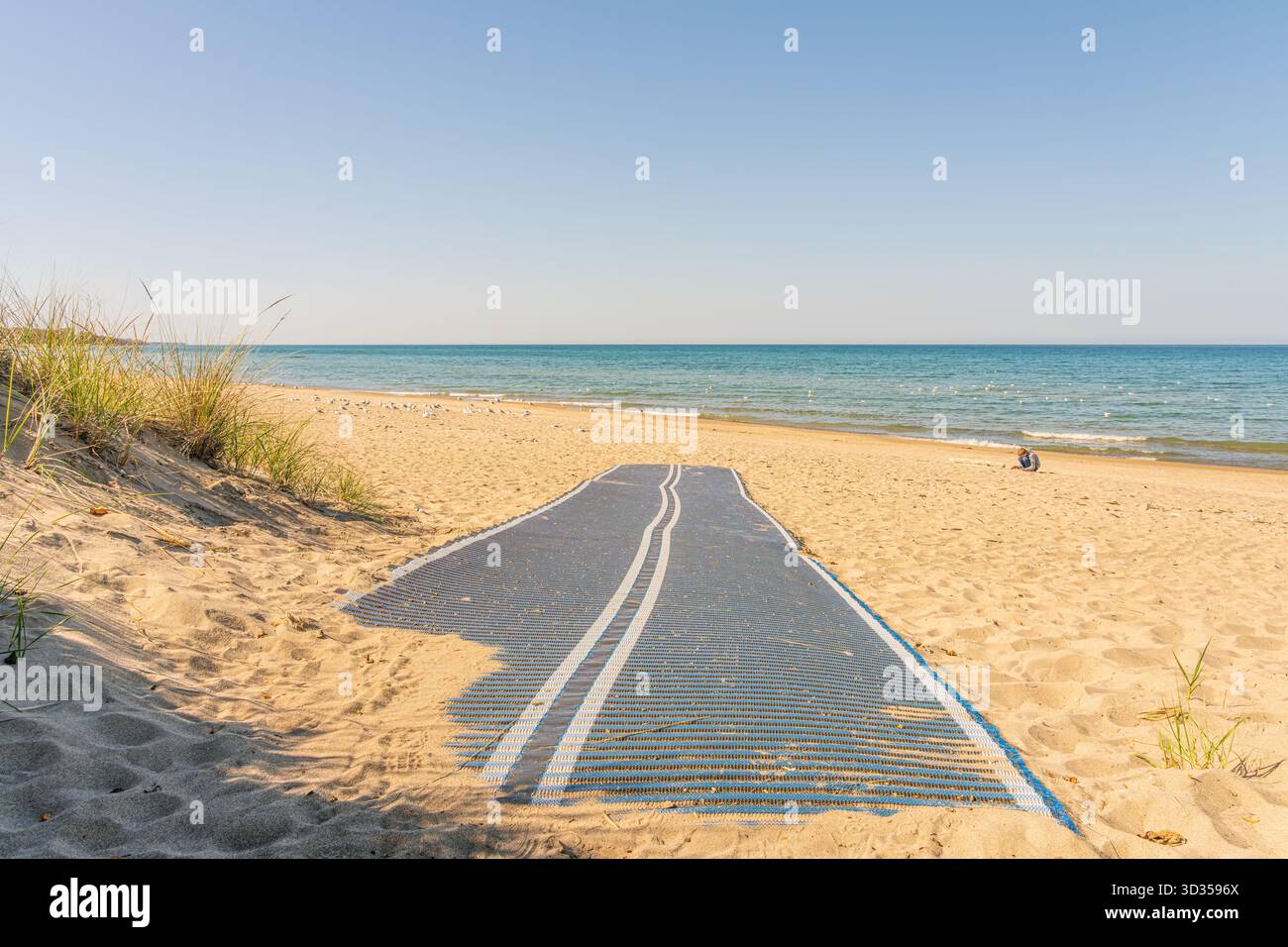 Beach mat or ramp designed to make the beach more accessable to those with wheelchairs or other mobility disabilities.  Kincardine Beach October 2025. Stock Photo