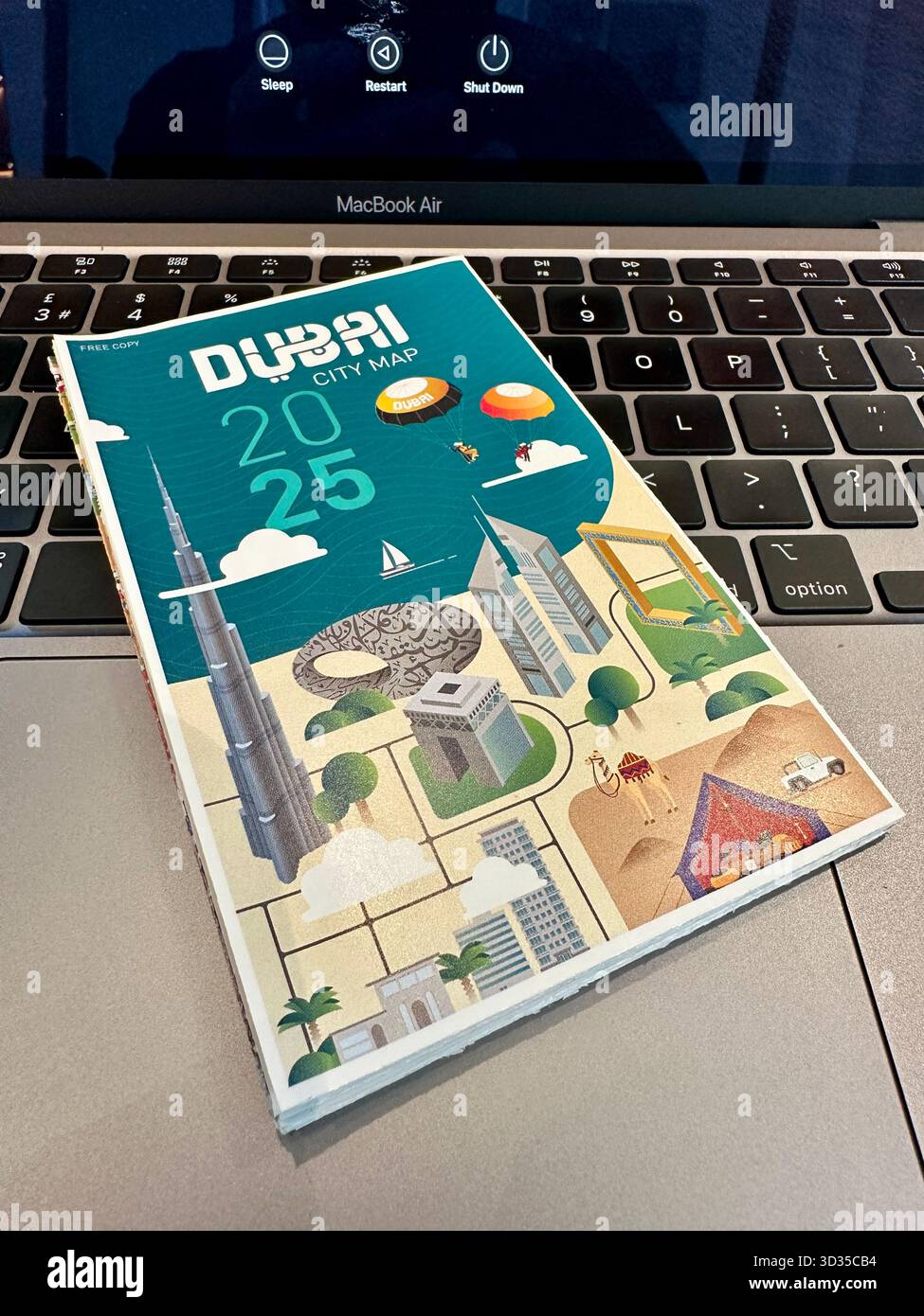 dubai map on laptop keyboard - Smartphone Captured Stock Image