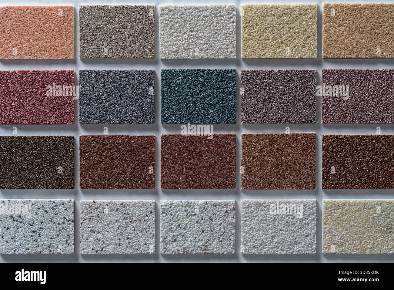 Samples of multi colored plaster for the decoration of the facade and ...