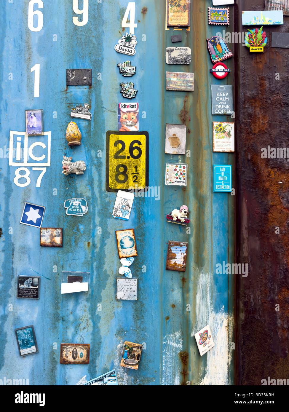 Various Colourful Fridge Magnets Attached to the Side of a Shipping Container - Smartphone Captured Stock Image