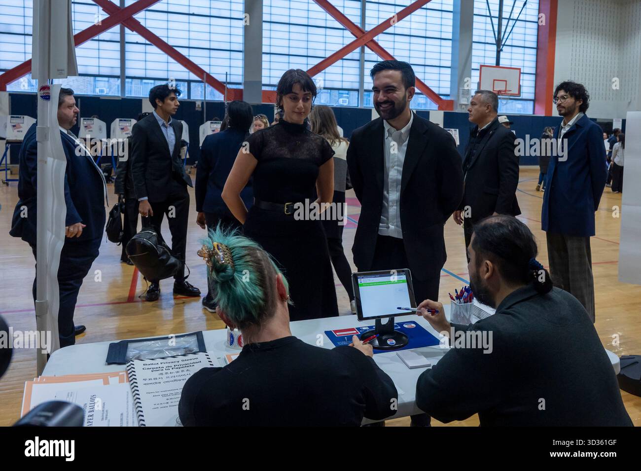 New York, United States. 04th Nov, 2025. Democratic New York City mayoral candidate Zohran Mamdani and his wife Rama Duwaji check-in at polling station to cast their vote in the general election at Frank Sinatra High School in New York City. Credit: SOPA Images Limited/Alamy Live News Stock Photo