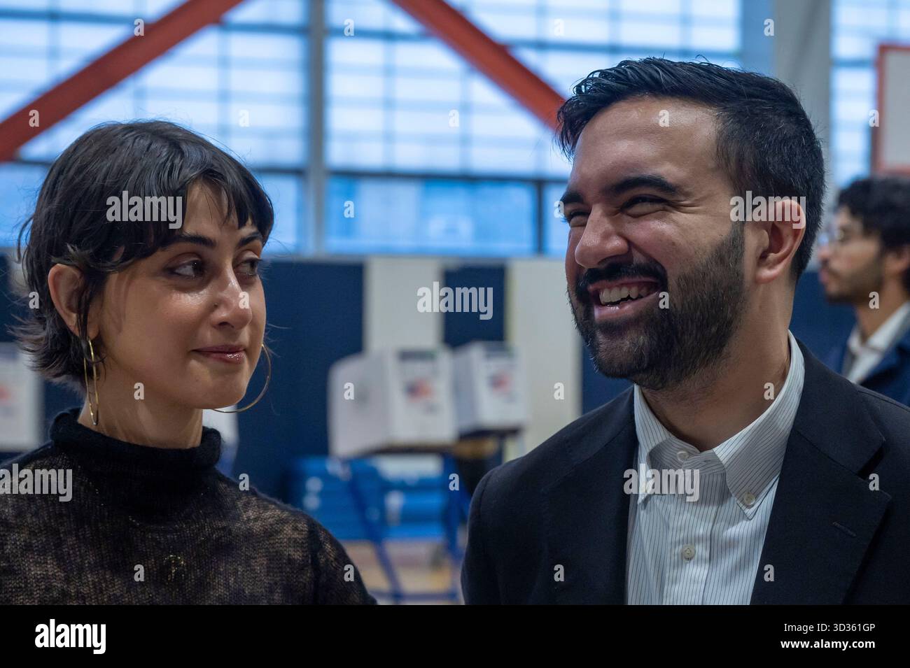 New York, United States. 04th Nov, 2025. Democratic New York City mayoral candidate Zohran Mamdani and his wife Rama Duwaji check-in at polling station to cast their vote in the general election at Frank Sinatra High School in New York City. Credit: SOPA Images Limited/Alamy Live News Stock Photo