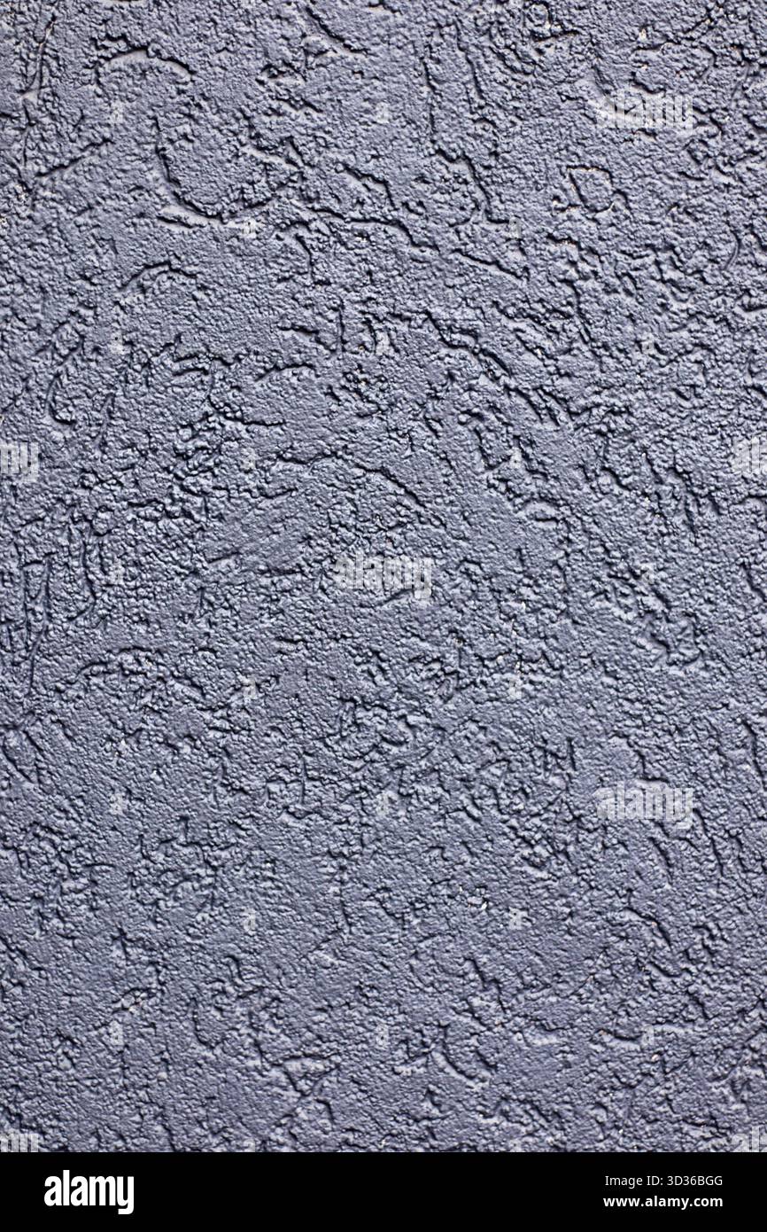 Textured gray concrete wall surface with rough, irregular patterns suitable as a background Stock Photo