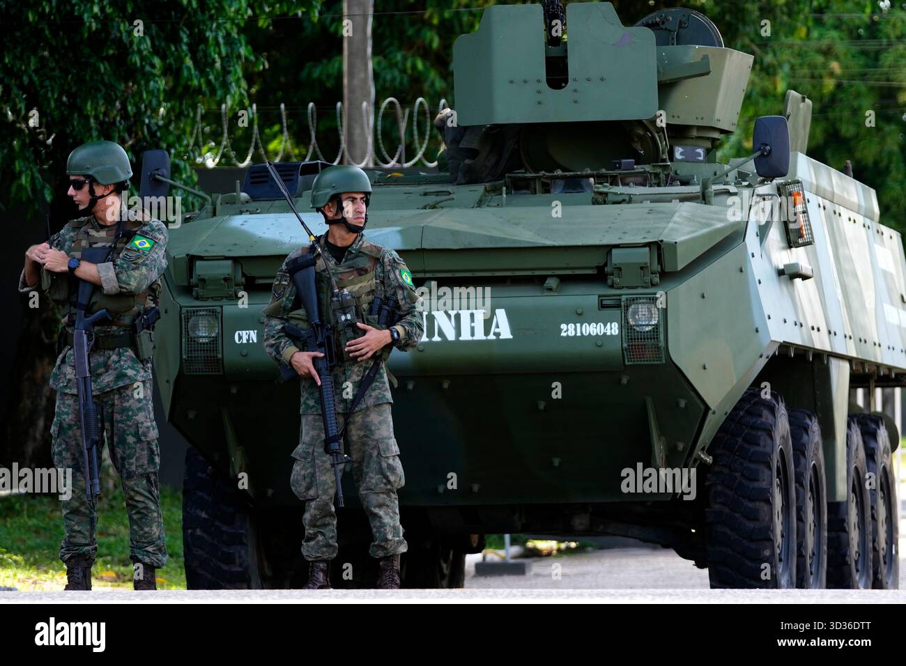 Soldiers stand guard by City Park, the site of the COP30 U.N. Climate ...