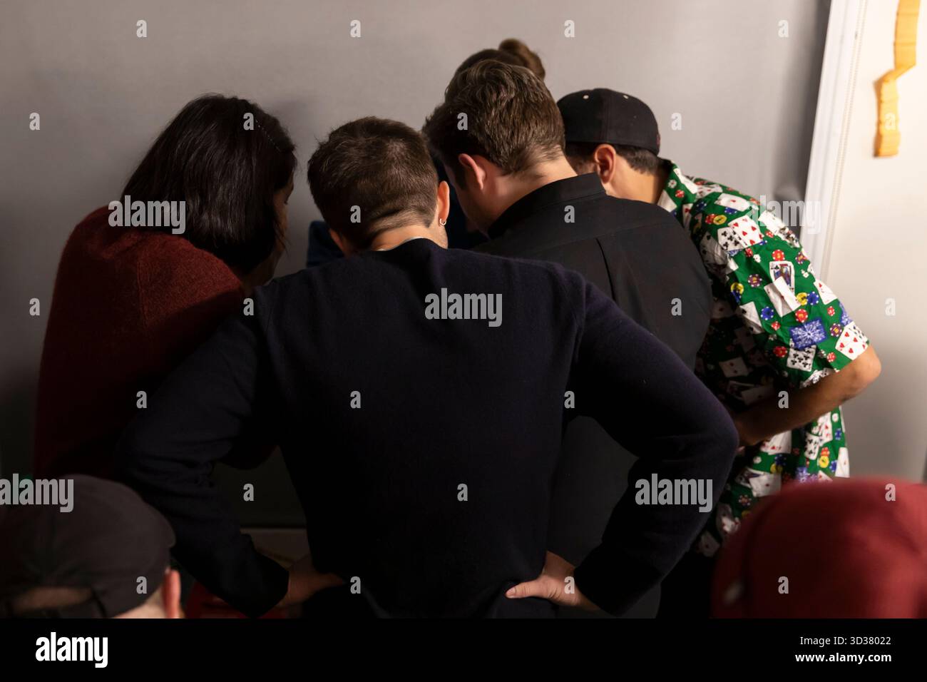 Seattle, Washington, USA. 4th November 2025. Progressive mayoral candidate Katie Wilson huddles with campaign staff as early results are released during an election night party at El Centro de la Raza. Wilson led the incumbent Seattle mayor Bruce Harrell by a healthy margin winning an outright majority in the top-two primary in August. Credit: Paul Christian Gordon/Alamy Live News Stock Photo