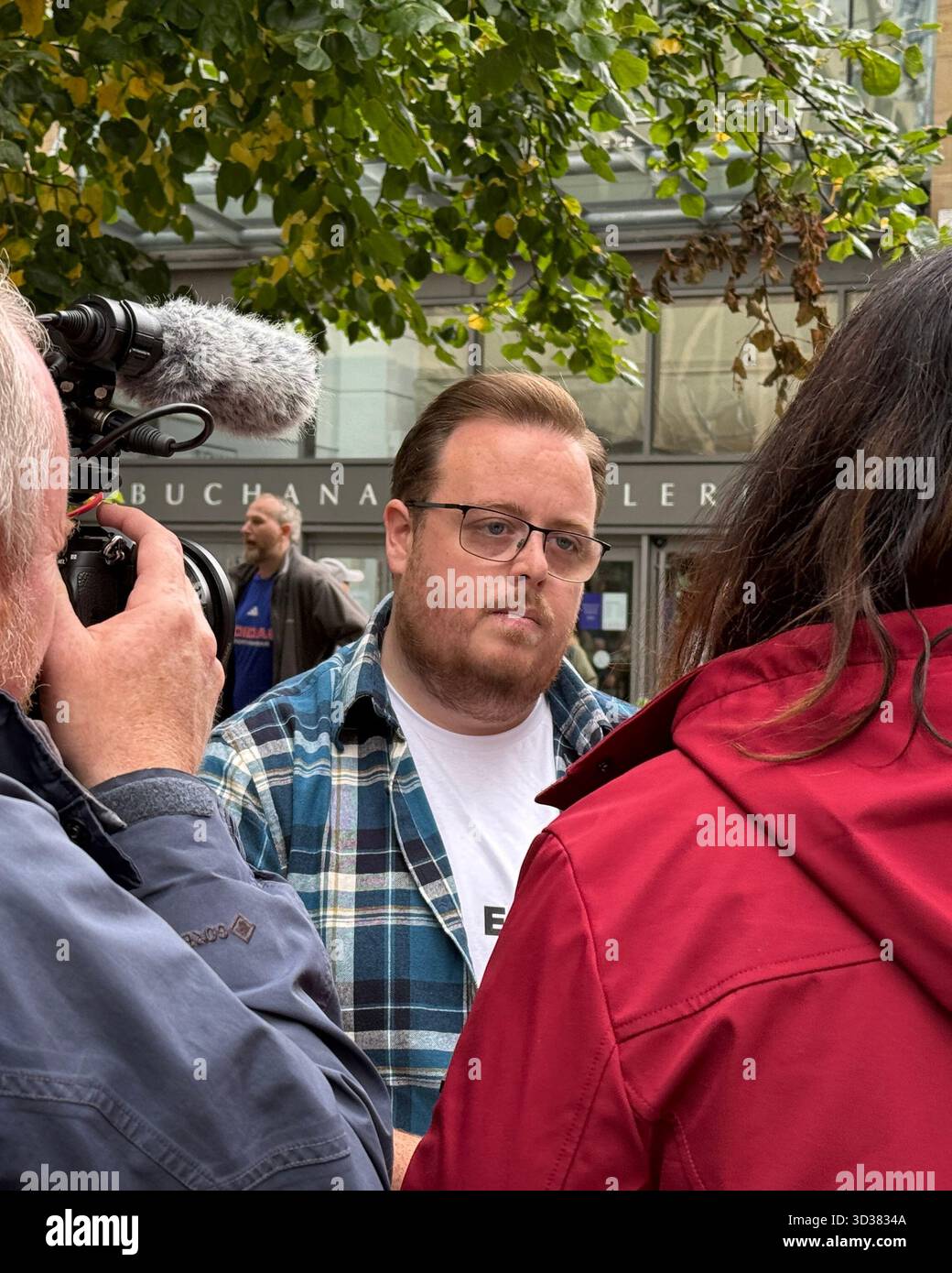 Councillor Thomas Kerr of Reform being interviewed by Channel 4 News on 20 September 2025 - Smartphone Captured Stock Image