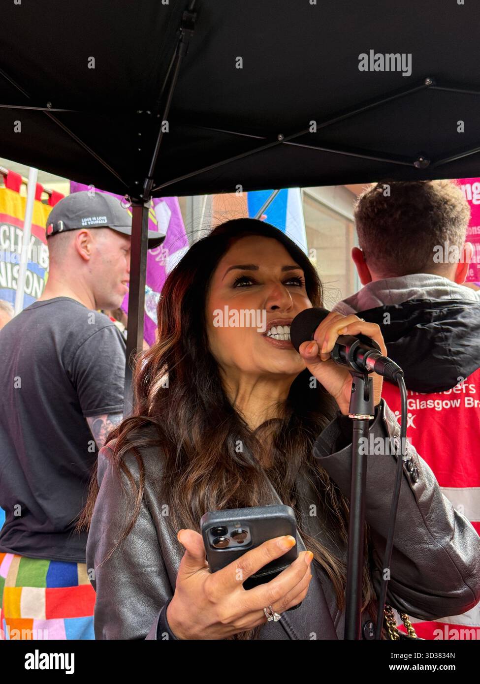Zamard Zahid speaking at a Stand Up to Racism counter-protest - Smartphone Captured Stock Image