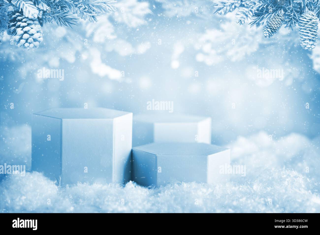 Hexagon white podiums in snowy scenery under frosted pine branches, ideal for product displays or seasonal advertising. Stock Photo