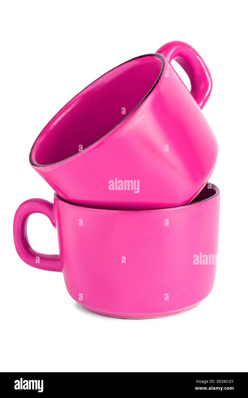 Two fuchsia pink ceramic empty coffee cups isolated on white background Stock Photo