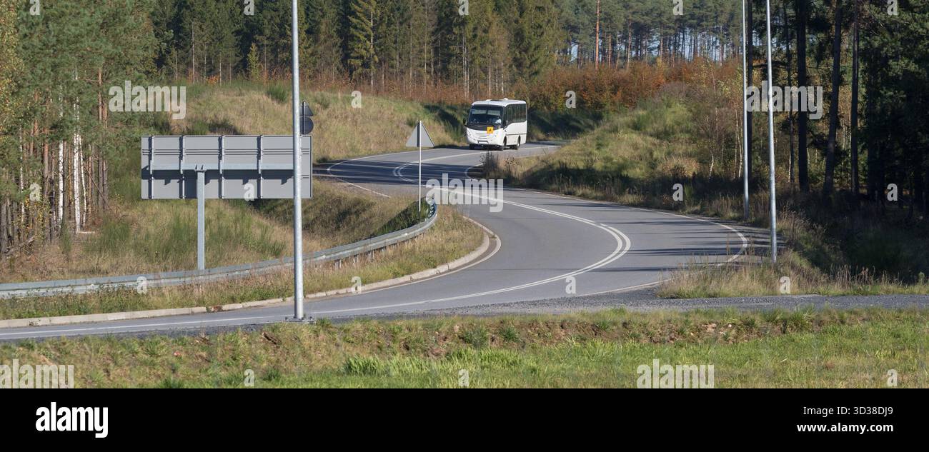 ASPHALT ROAD AND SHOOL BUS Stock Photo