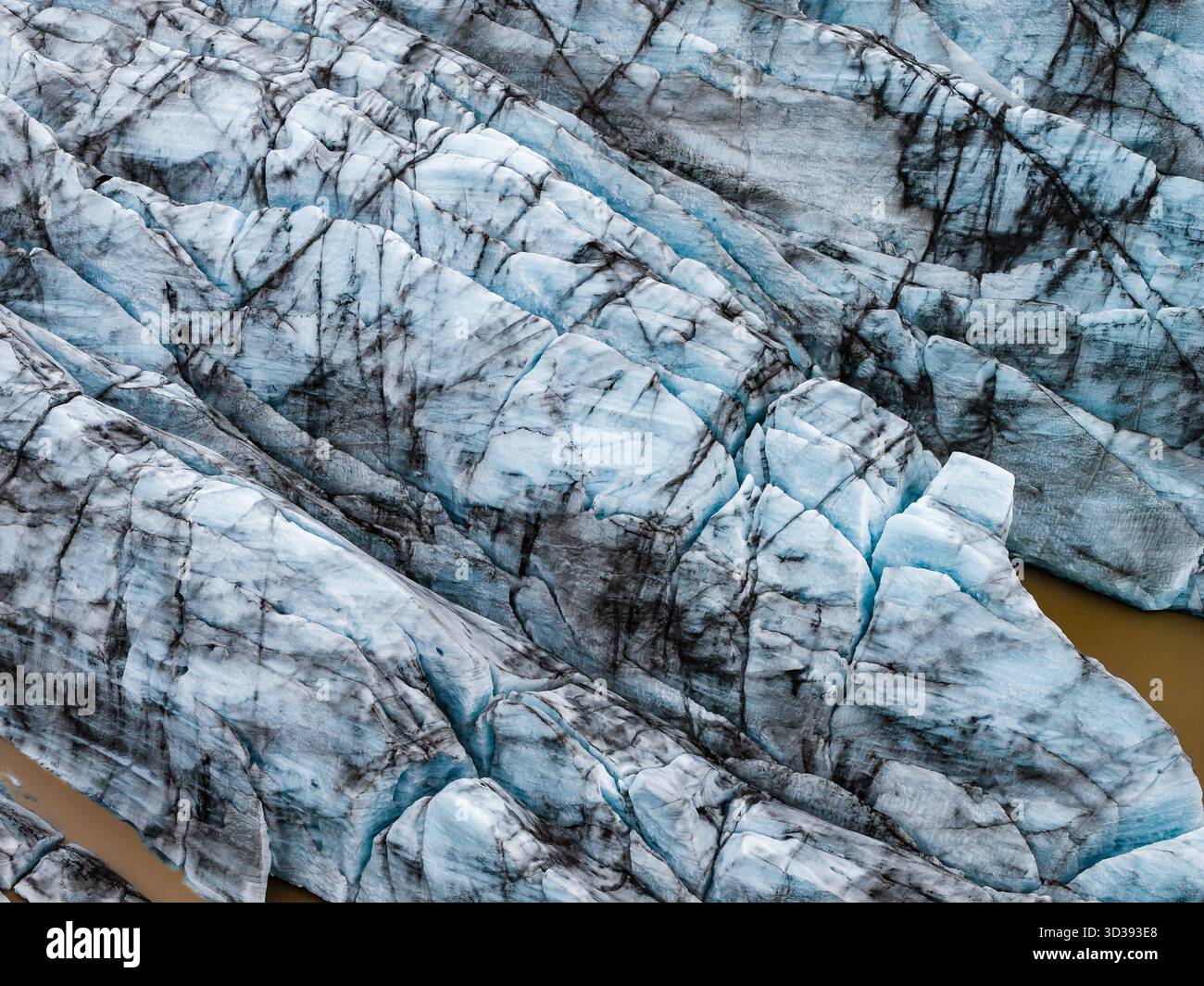 Aerial close up of blue glacier tongues with ash in Iceland lagoon Stock Photo