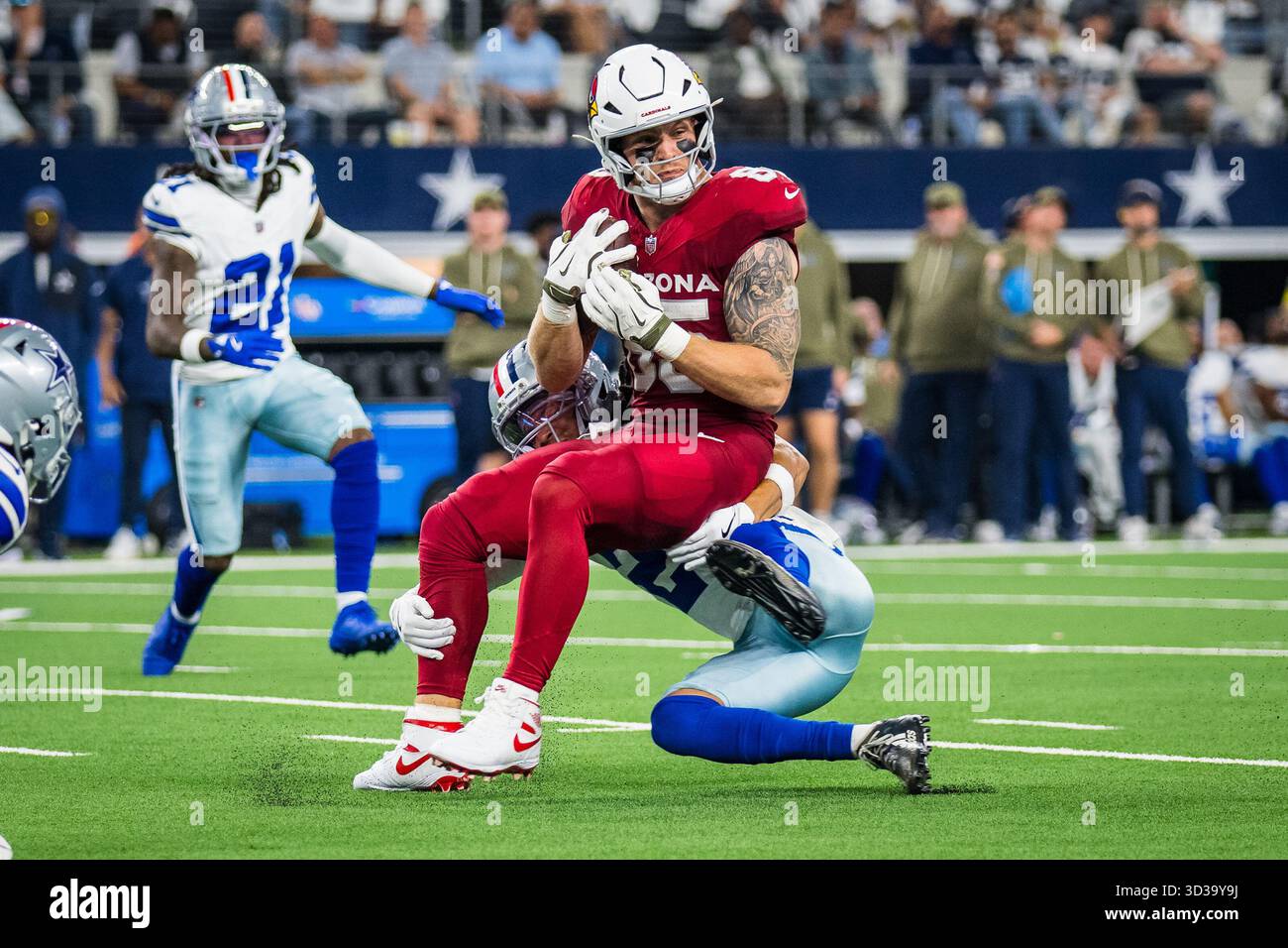 Arizona Cardinals tight end Trey McBride (85) is tackled by Dallas ...