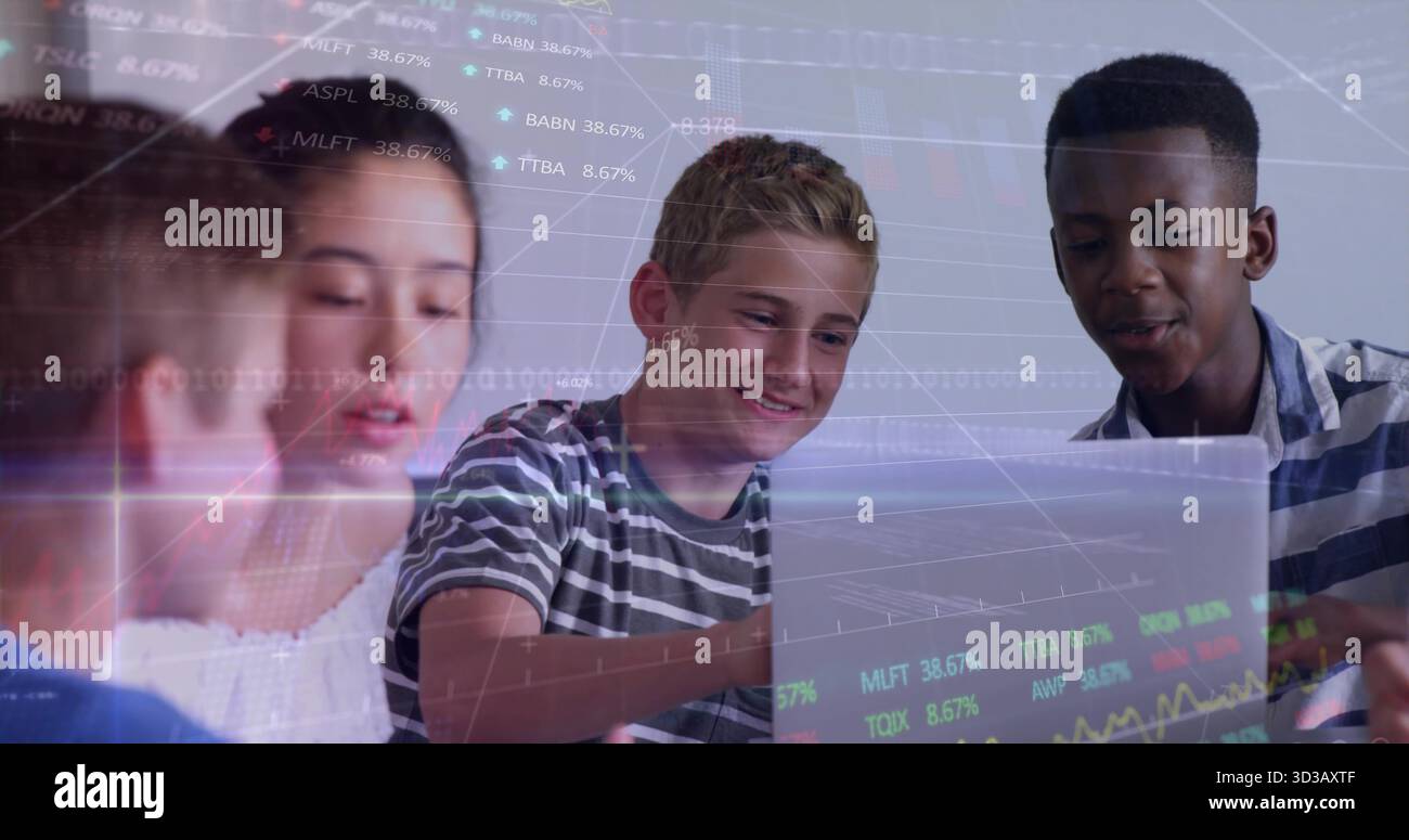Working four students collaborating using laptop on table in bright study room, with chart overlays Stock Photo