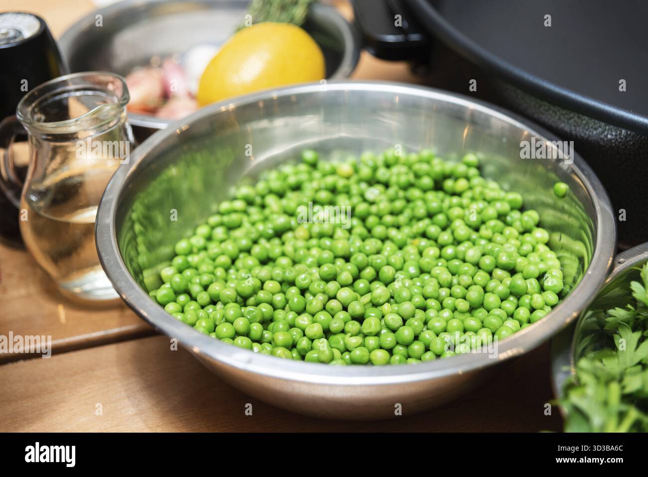 Food, Large metal colander filled with cooked white rice sits atop a ...