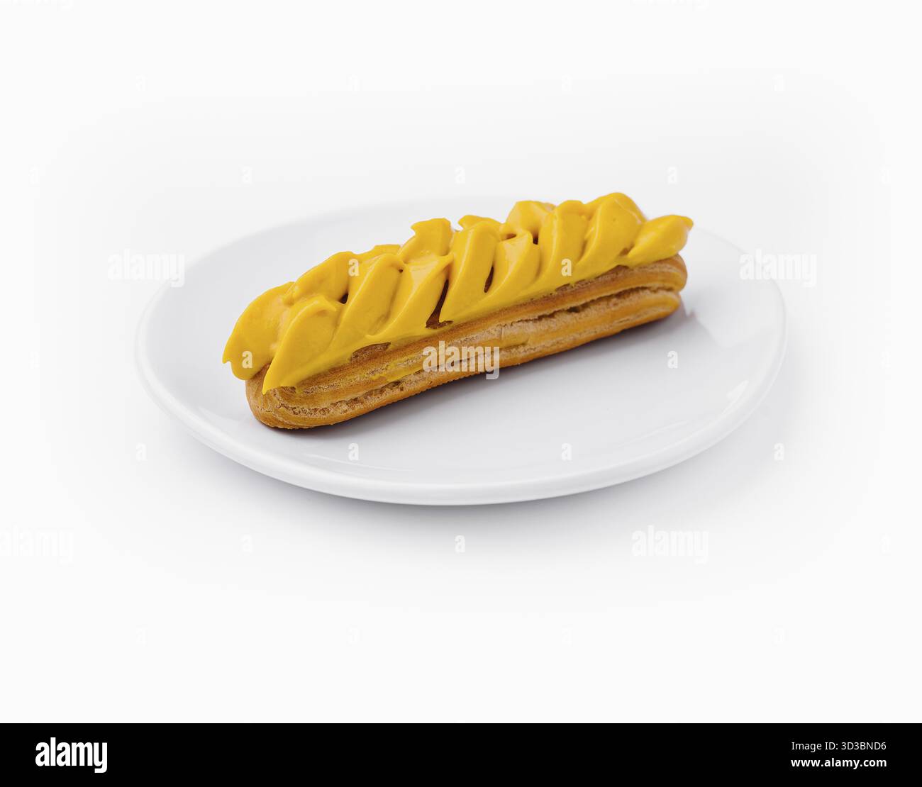 Food, Eclair with Mango Cream on White Plate Stock Photo
