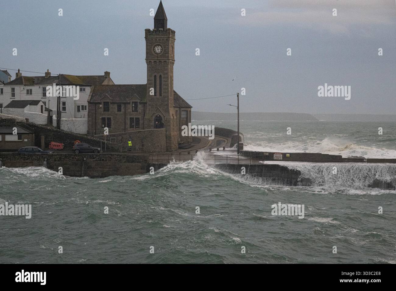 Porthleven are particularly vulnerable to storm surge, large breaking waves, and high tides, especially when wind and tide combine. Stock Photo