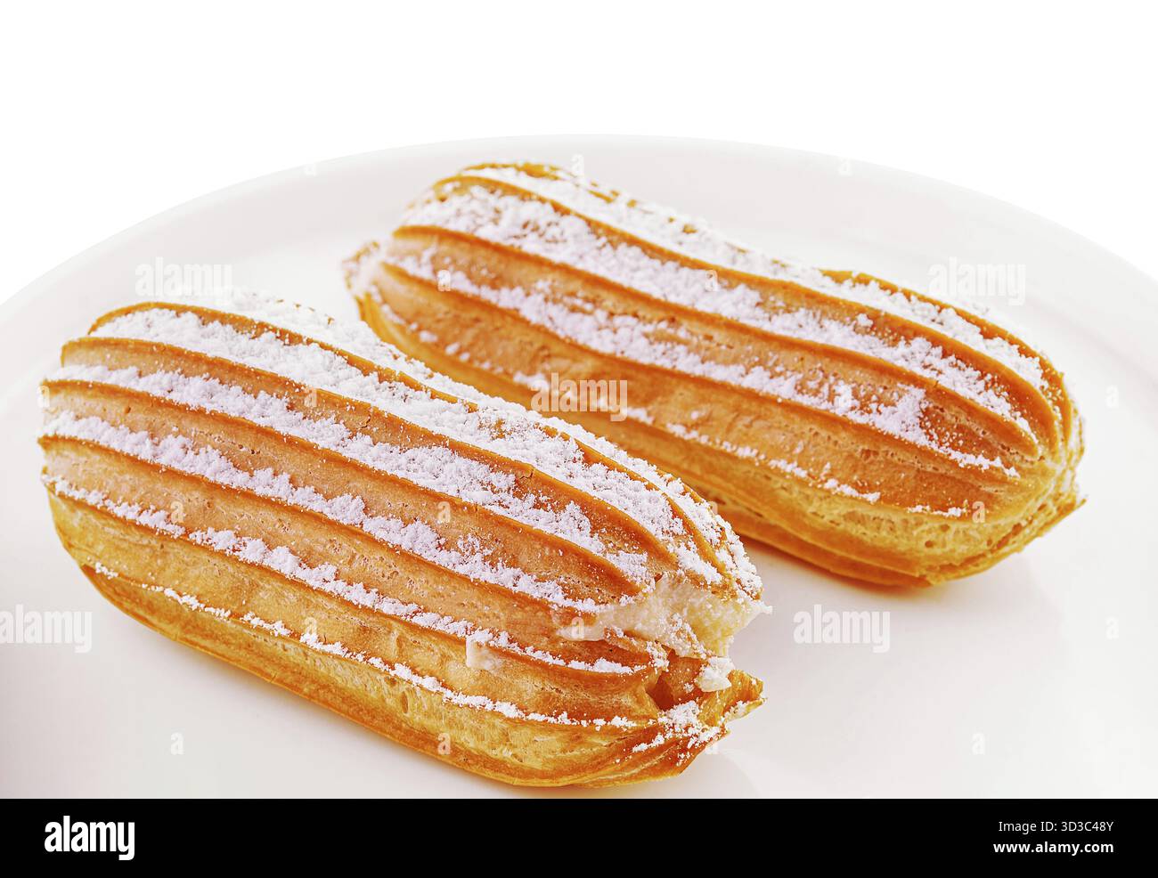 Food, Two eclairs on white plate isolated Stock Photo