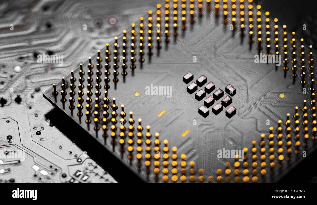 Macro Close up of microchips and pins on Main CPU PC processor circuit board Stock Photo