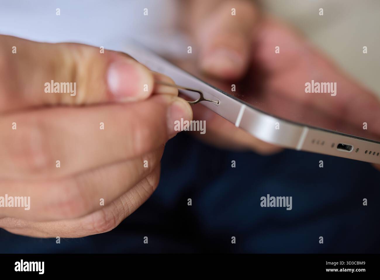 Guide on how to properly insert a SIM card into a smartphone using a ...