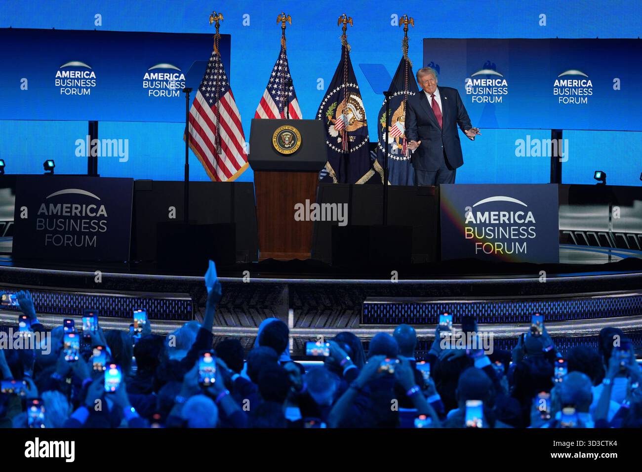 President Donald Trump on stage before speaking at the America Business ...