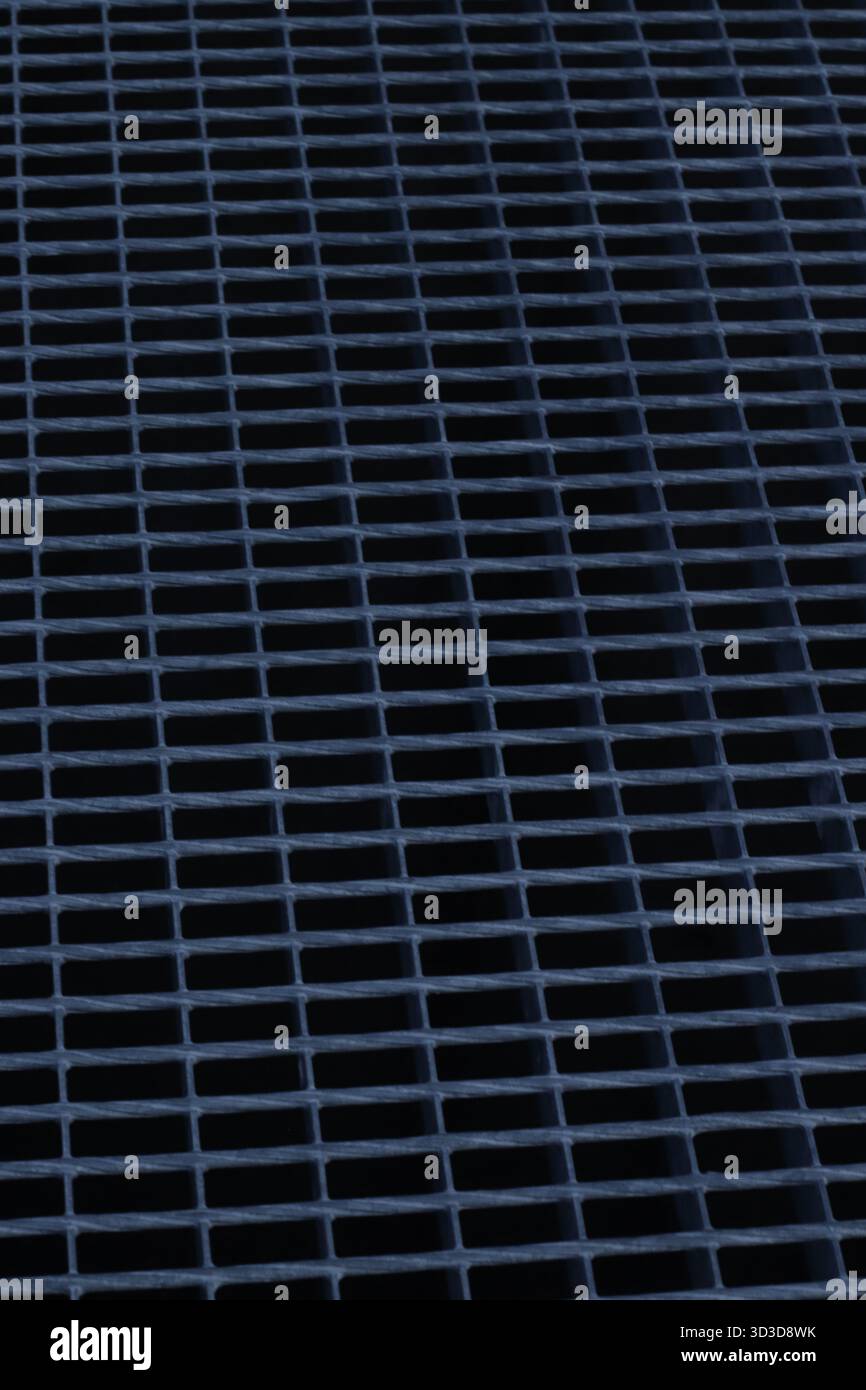 Abstract geometric metal surface with repeating grid pattern, minimal industrial texture Stock Photo