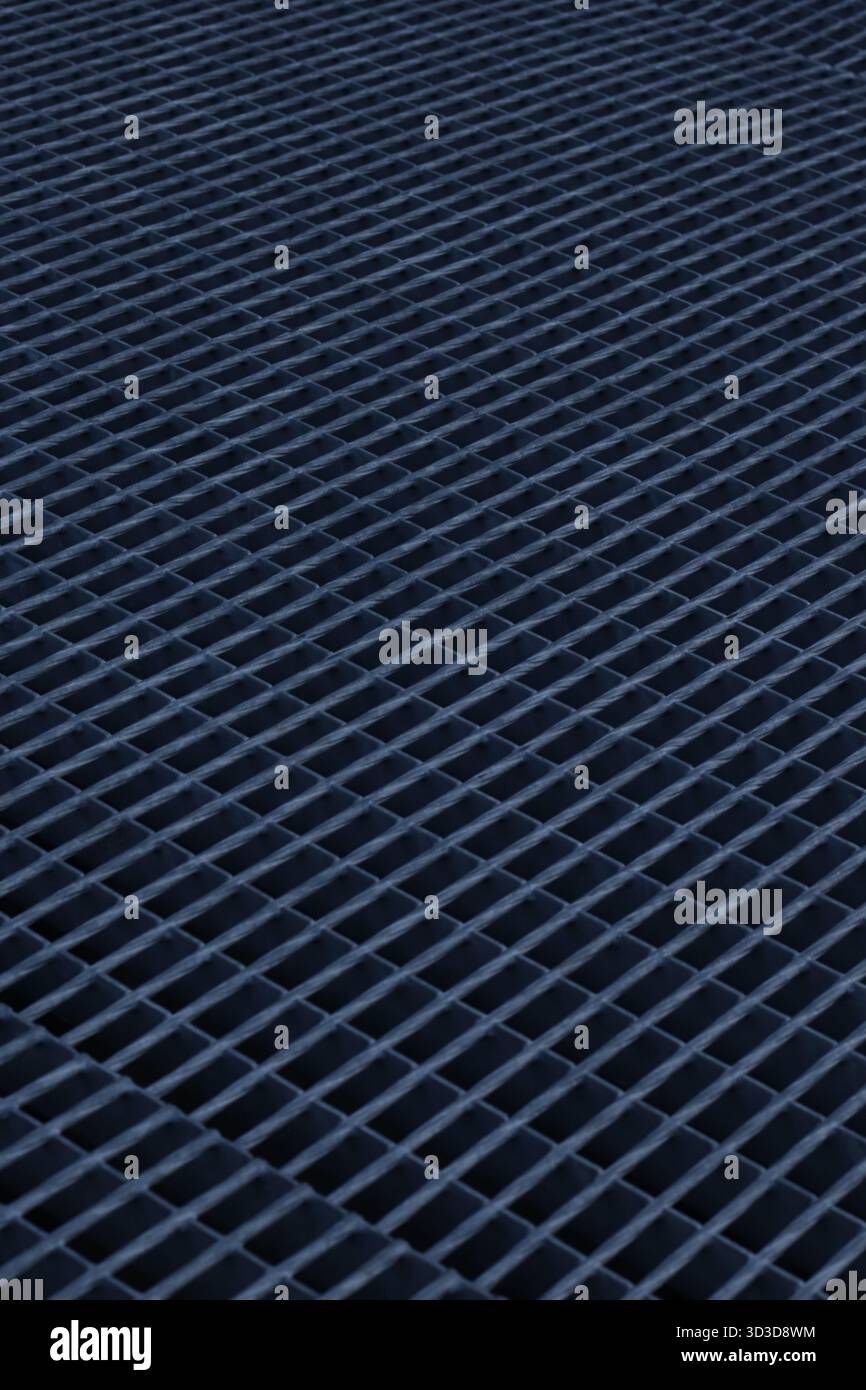 Abstract geometric metal surface with repeating grid pattern, minimal industrial texture Stock Photo