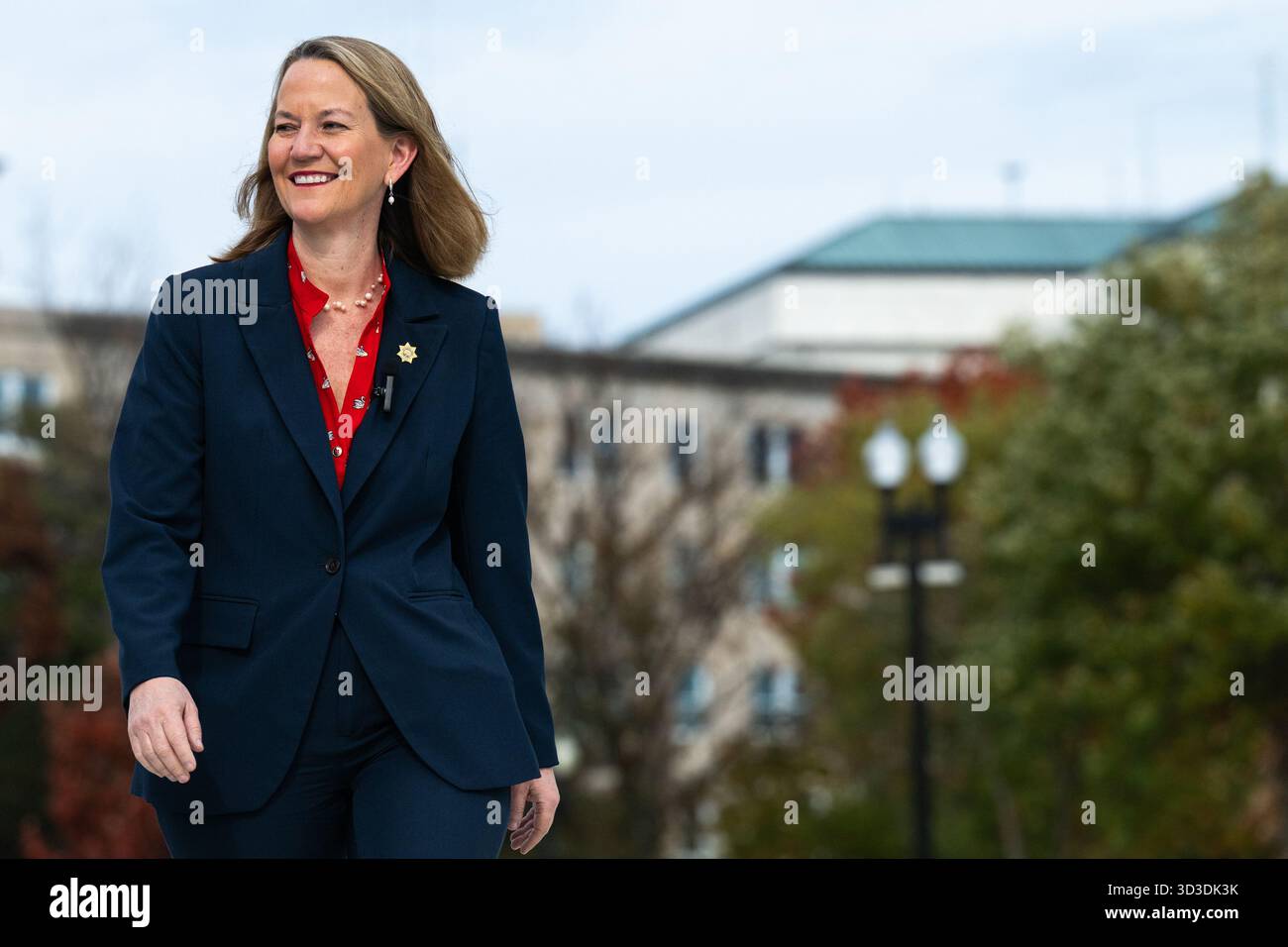 Arizona Attorney General Kris Mayes walks to speak to press in front of ...