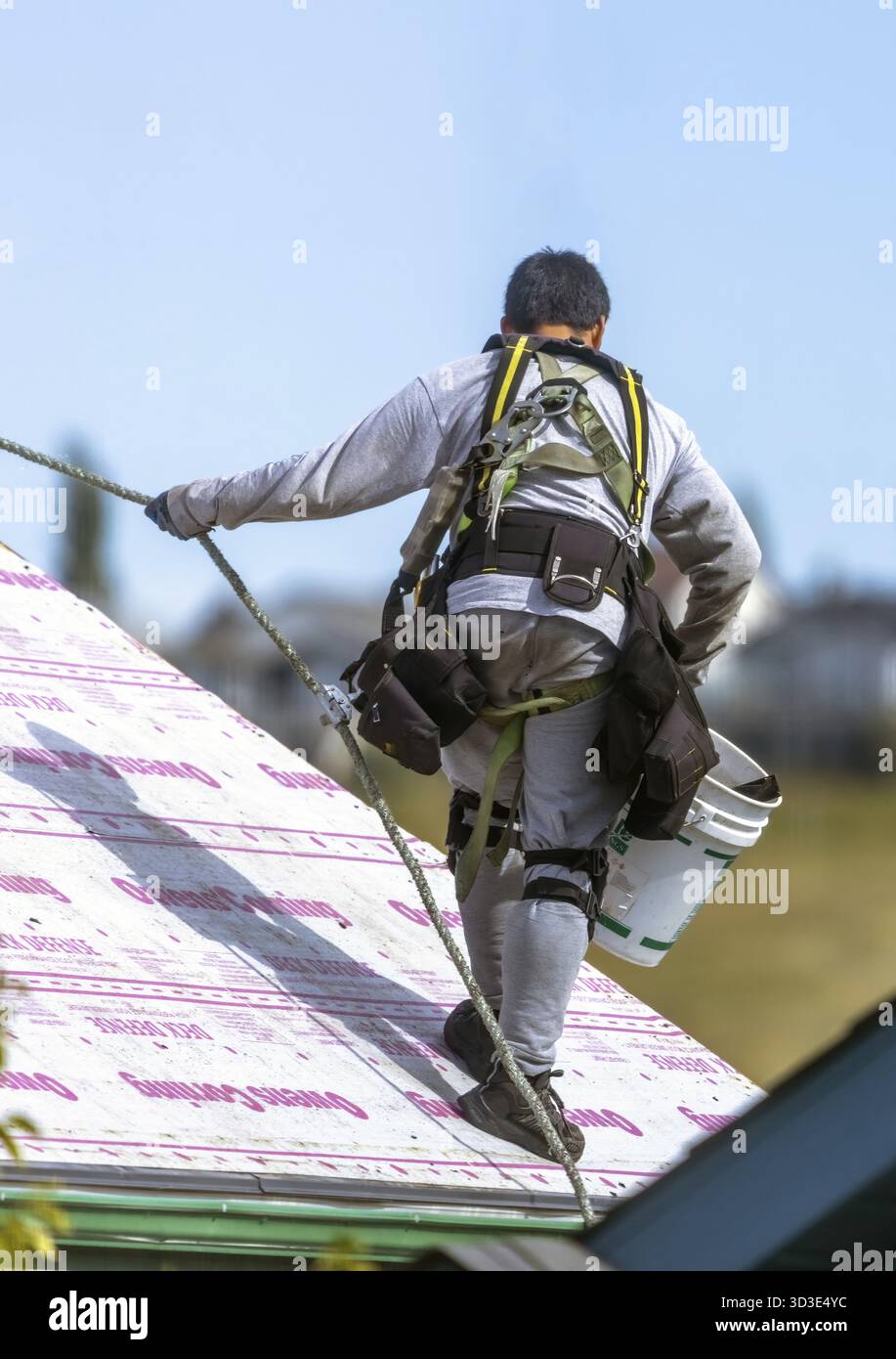 Worker walks on roof hi-res stock photography and images - Alamy