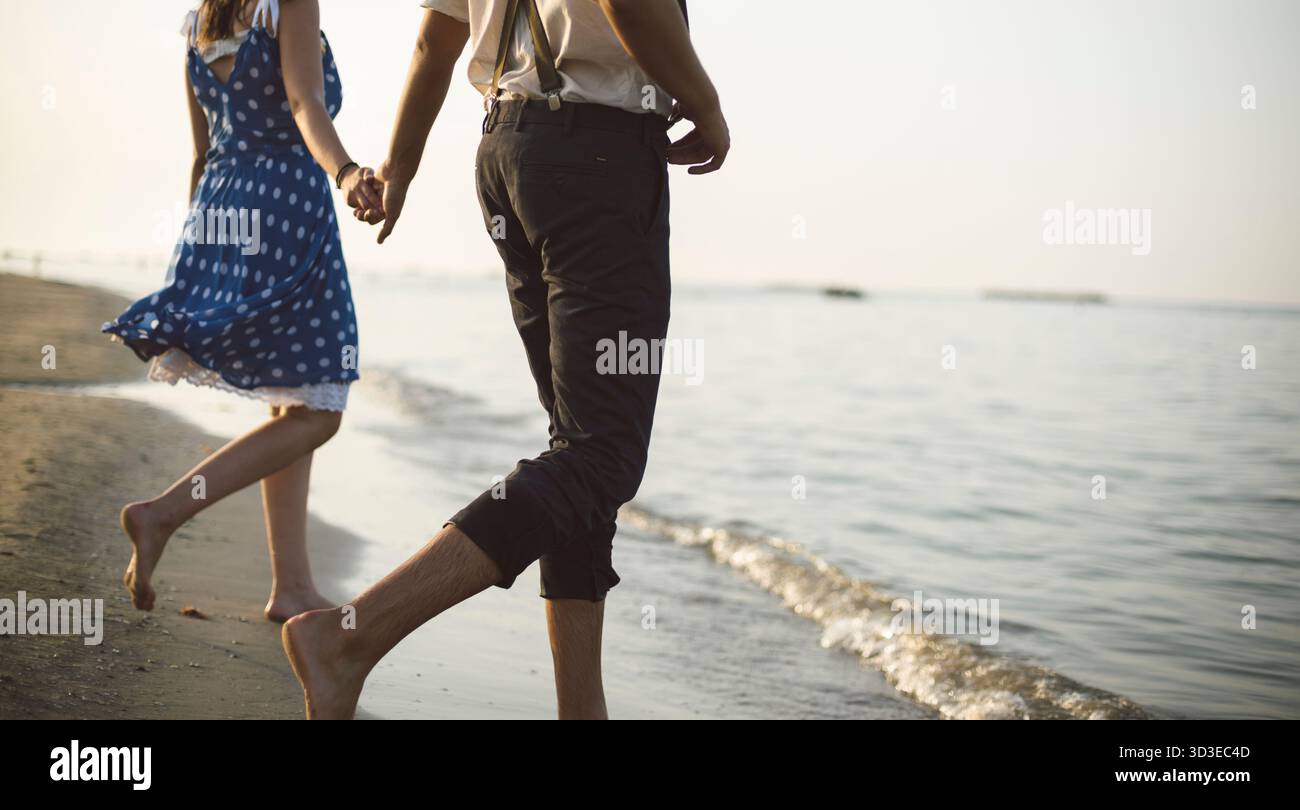 Walking barefoot along beach hi-res stock photography and images - Alamy