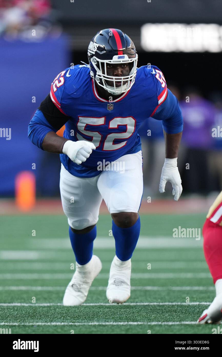 Model Victor Rushes New York Giants linebacker Victor Dimukeje (52) rushes the passer ...