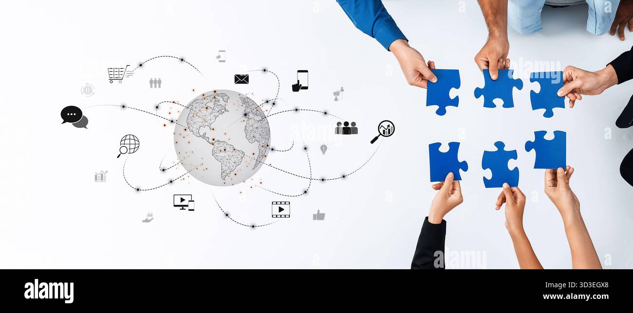 A creative concept showcasing hands holding puzzle pieces symbolizing teamwork, connected through digital elements representing global collaboration Stock Photo